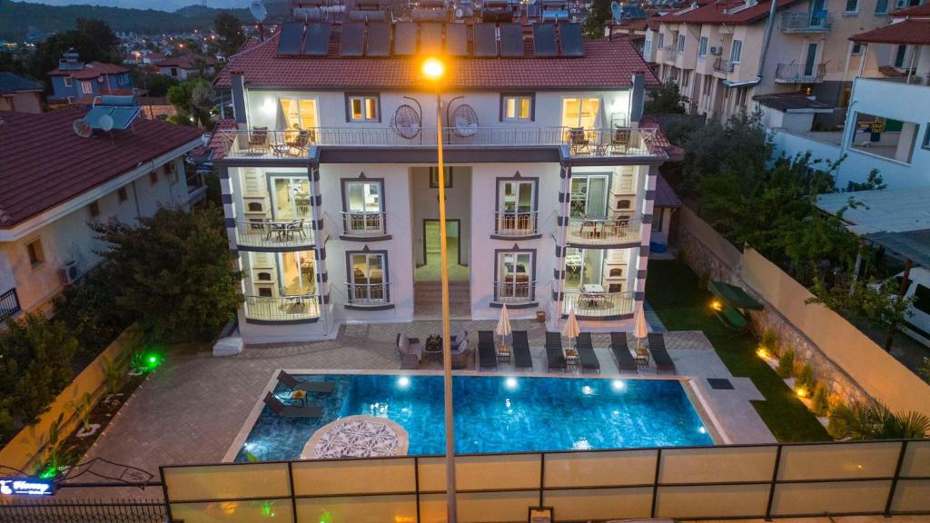 an aerial view of a house with a swimming pool at HONEY SUİTEs 1 in Fethiye
