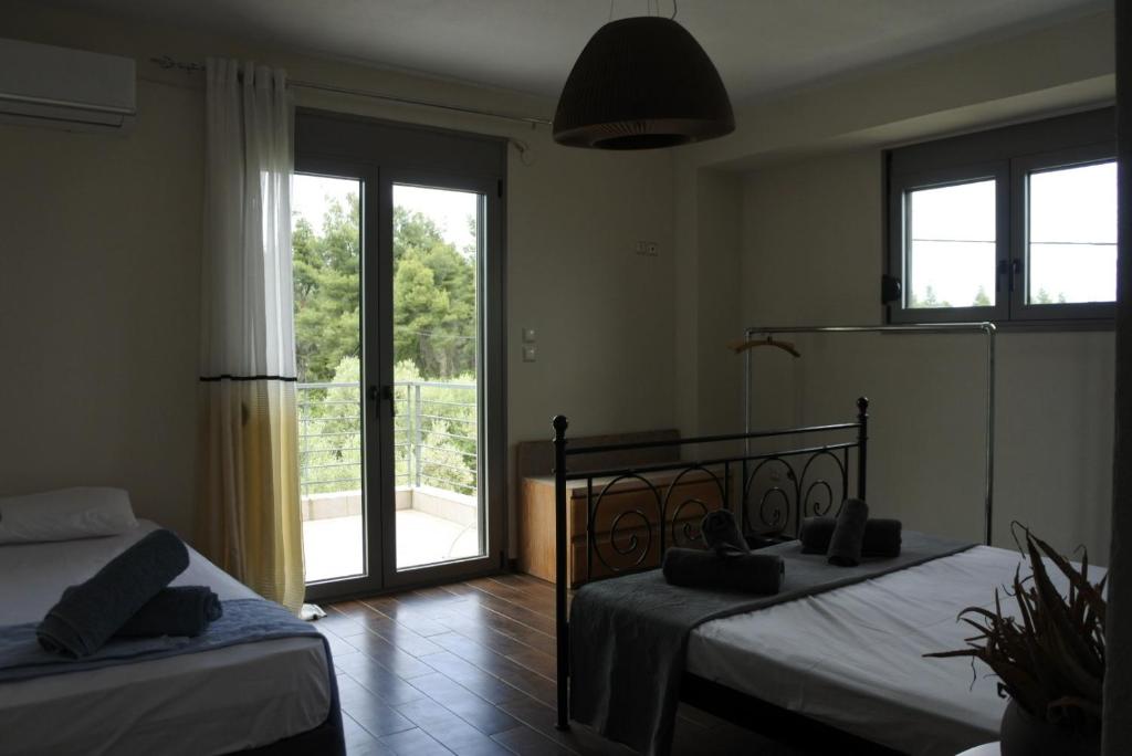 Postel nebo postele na pokoji v ubytování Villa Aggelos