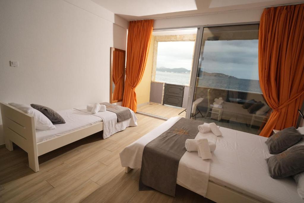 Postel nebo postele na pokoji v ubytování Suites Castello
