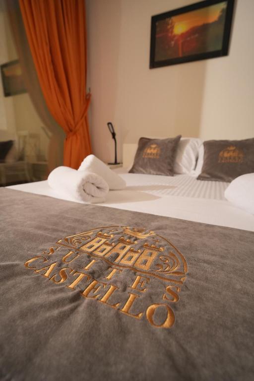 Postel nebo postele na pokoji v ubytování Suites Castello
