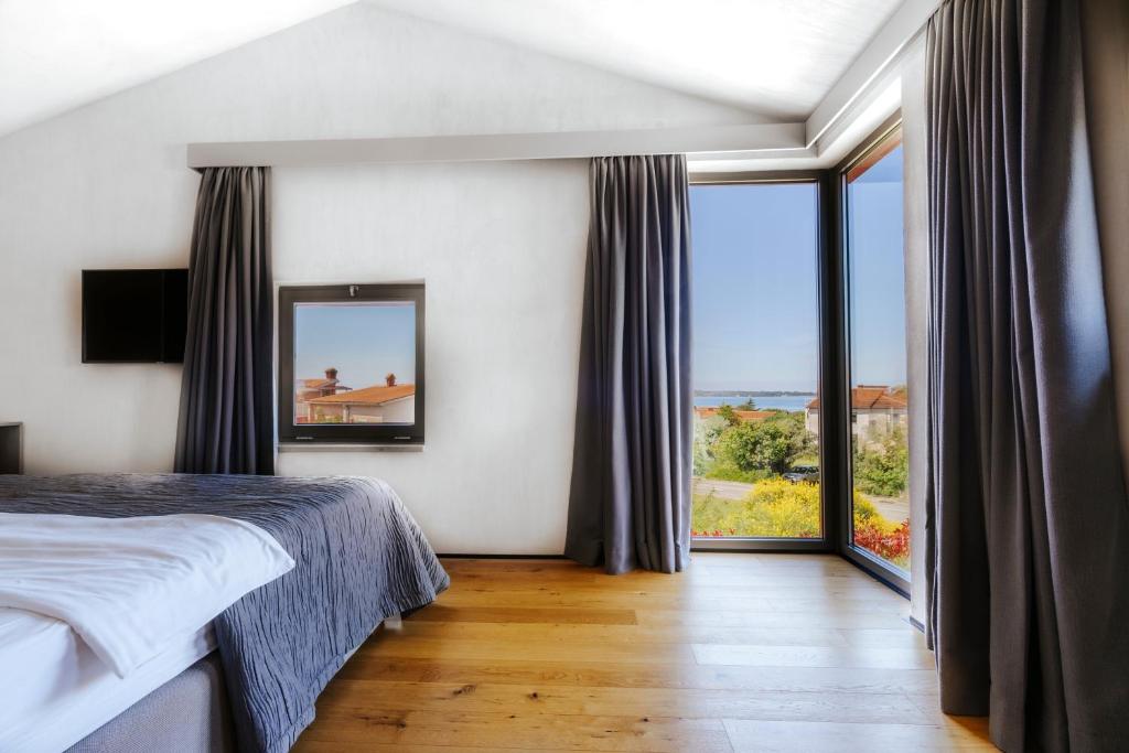 Postel nebo postele na pokoji v ubytování Villa Casa Ombra Rossa