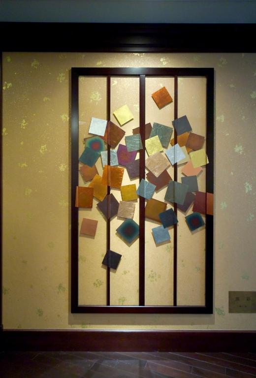 a window with a bunch of pieces of paper at Kanazawa Hakuchoro Hotel Sanraku -Natural Hot Spring- in Kanazawa
