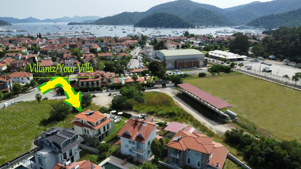 an aerial view of a city with houses and a lake at Villa Dream Göcek in Fethiye