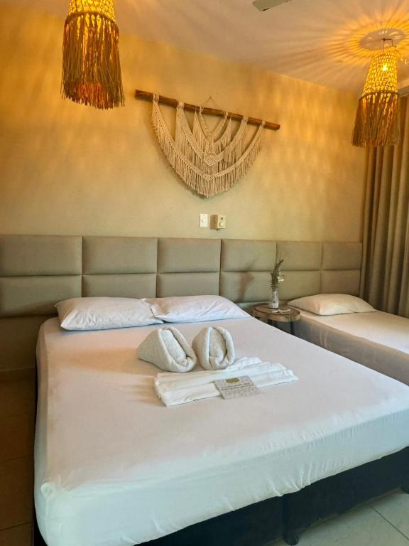 Voodi või voodid majutusasutuse Awa De Mar Hotel Tolu toas