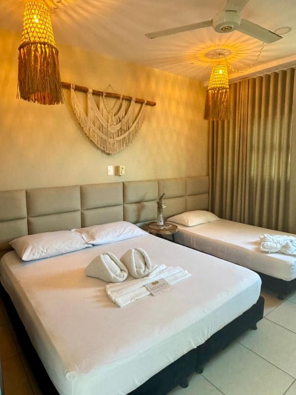 Voodi või voodid majutusasutuse Awa De Mar Hotel Tolu toas