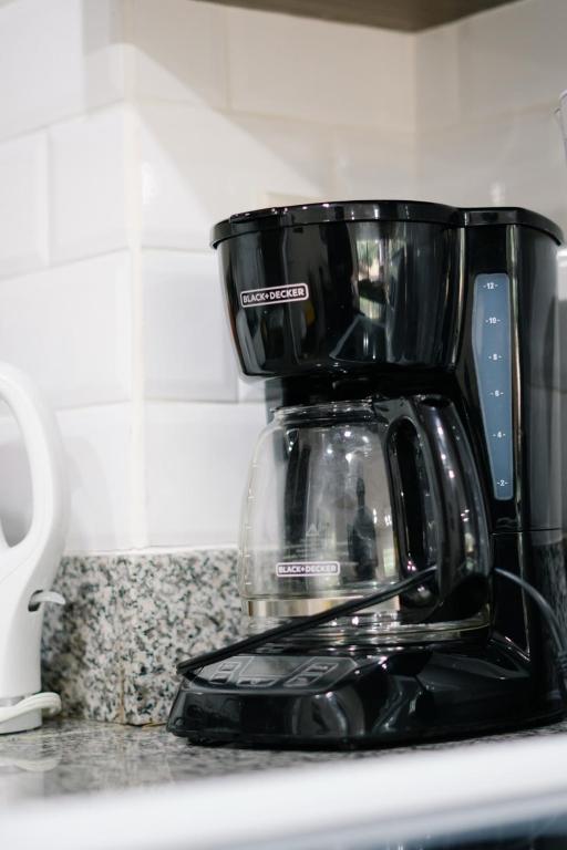 Příslušenství pro přípravu čaje a kávy v ubytování Apartamento Ganesha Liberia