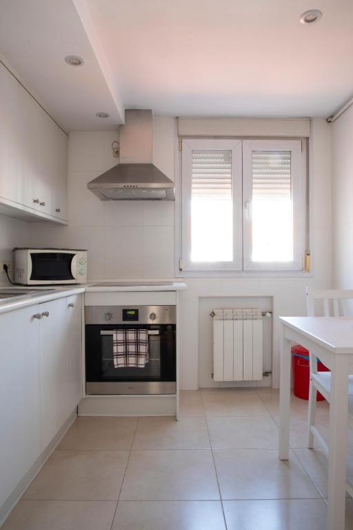 A kitchen or kitchenette at ÁTICO CENTRO HISTÓRICO MADRID