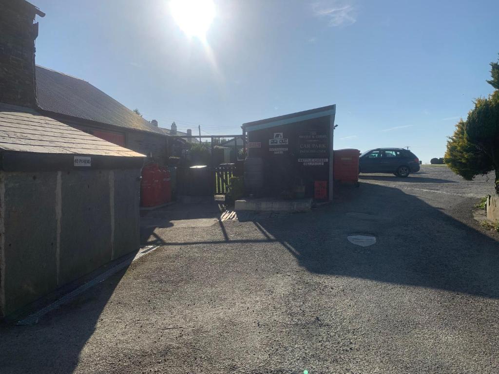 a truck is parked in a parking lot at The Chisel Coach House at The Bettle and Chisel in Delabole