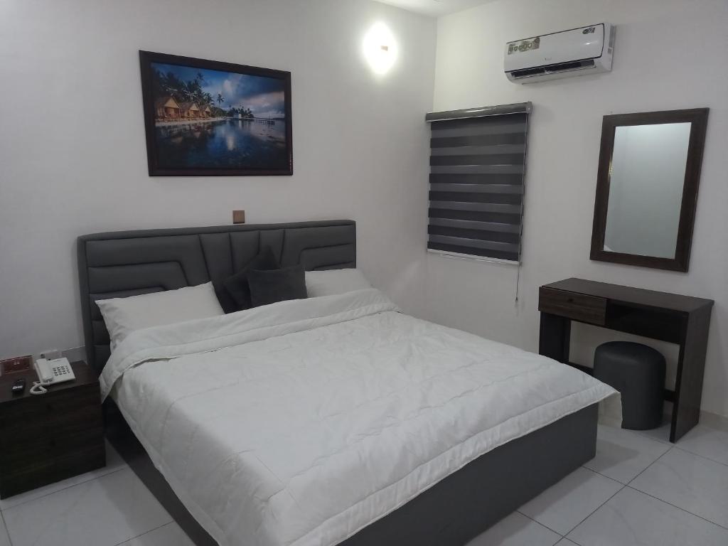 Postel nebo postele na pokoji v ubytování High five Apartment