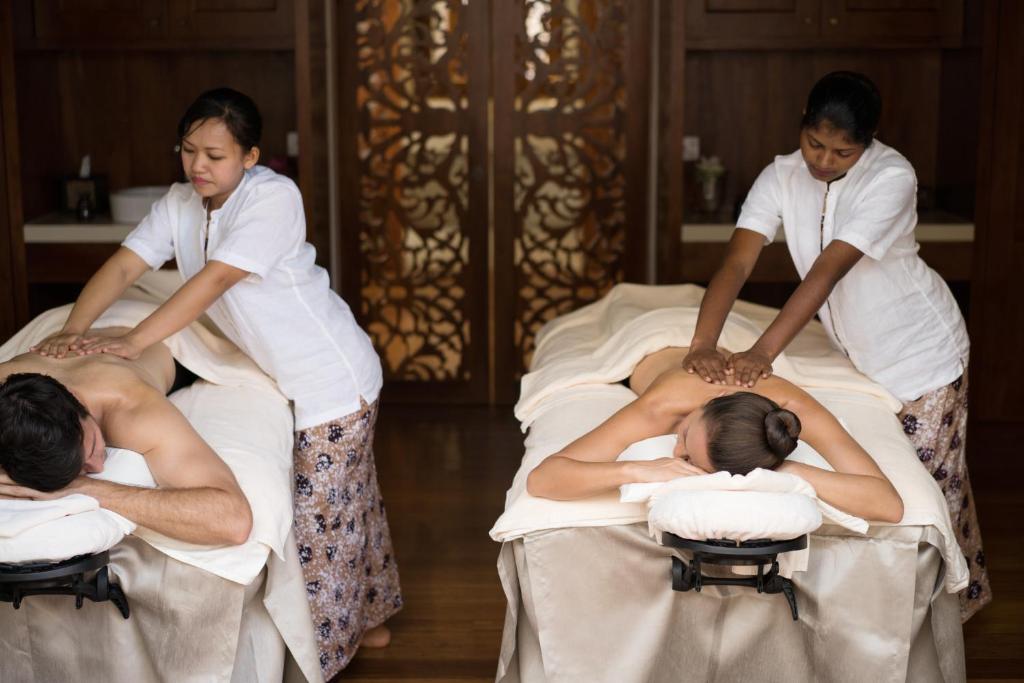 a group of people laying on beds at Anantara Peace Haven Tangalle Resort in Tangalle