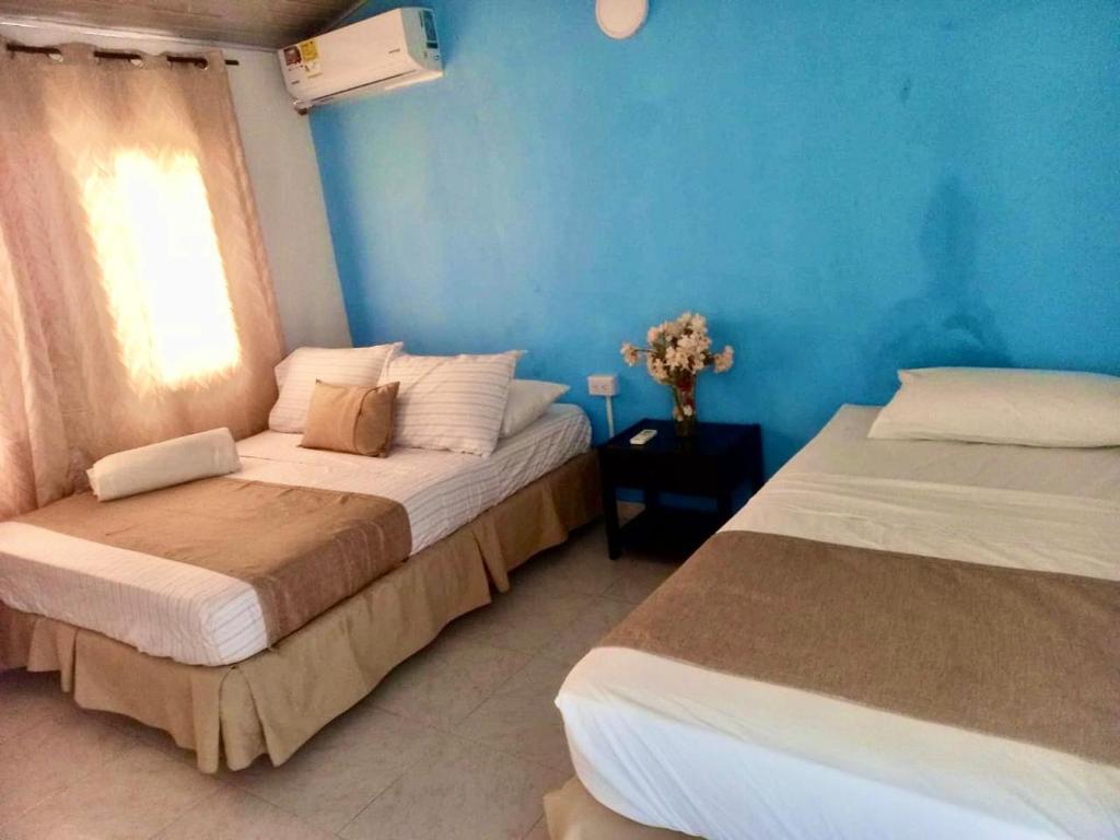 Uma cama ou camas num quarto em Hotel mantarraya