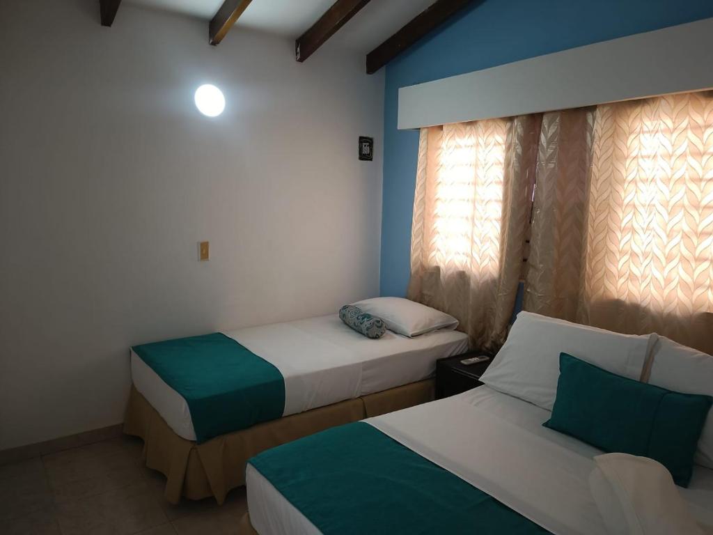 Uma cama ou camas num quarto em Hotel mantarraya