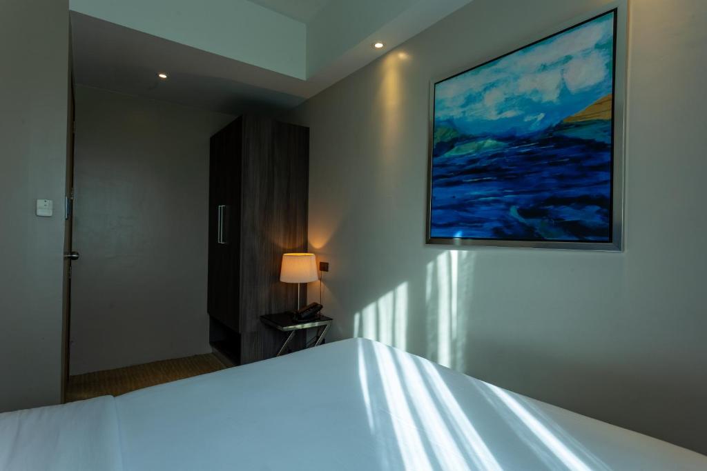 Postel nebo postele na pokoji v ubytování Santorini Hotel