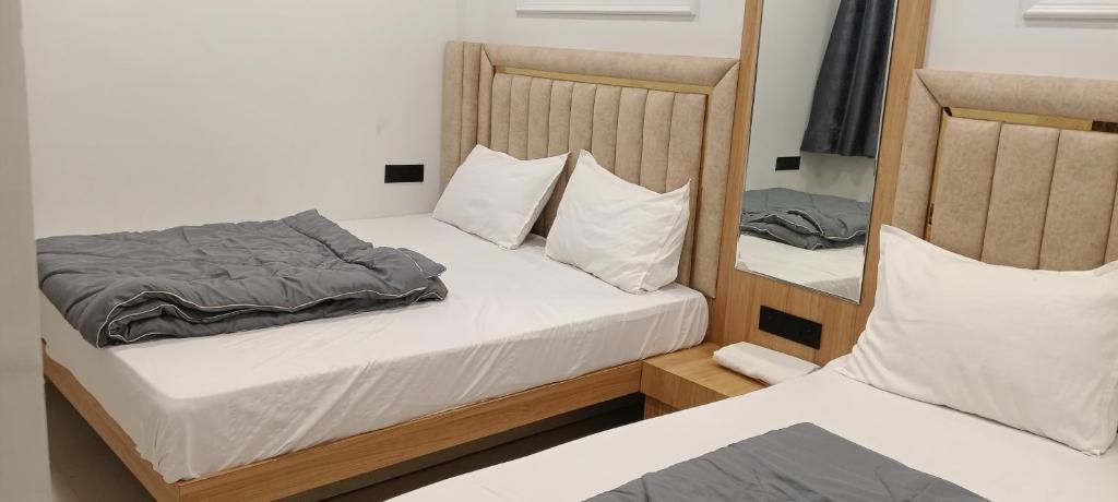 Postel nebo postele na pokoji v ubytování Cloud hotel