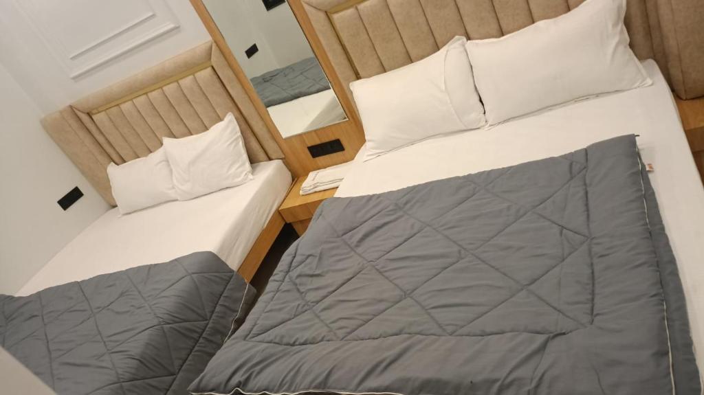 Postel nebo postele na pokoji v ubytování Cloud hotel