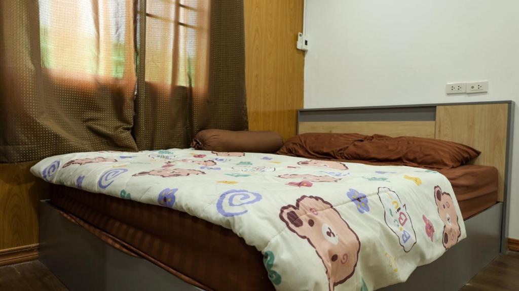 Postel nebo postele na pokoji v ubytování Baan Airport