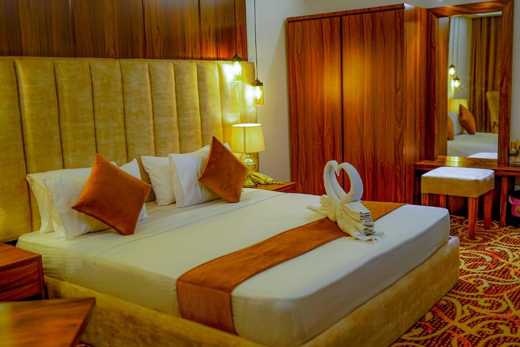 Postel nebo postele na pokoji v ubytování Ramadia Ran Mal Holiday Resort