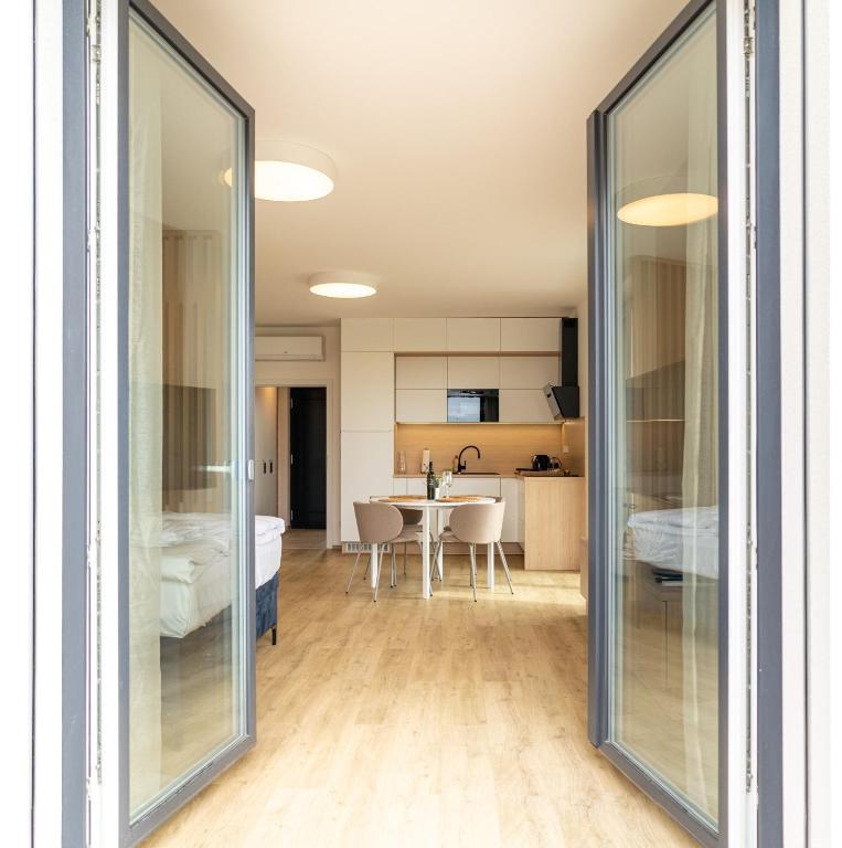 Postel nebo postele na pokoji v ubytování SOLARIS APARTMÁNY Pálava