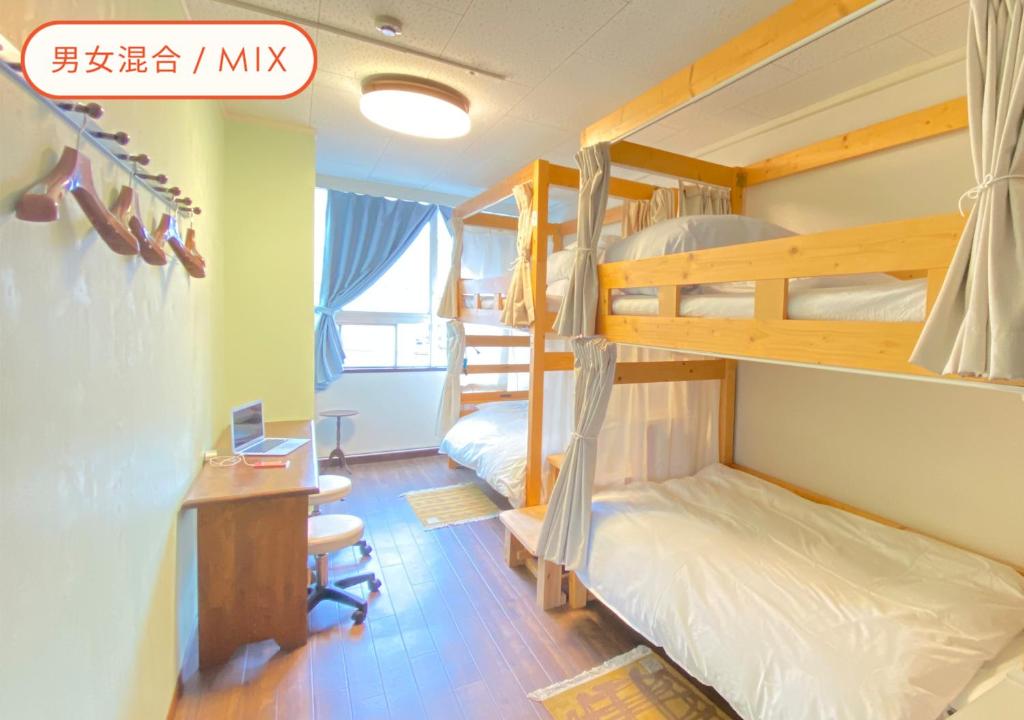 Postel nebo postele na pokoji v ubytování Almas Guest House(アルマス）