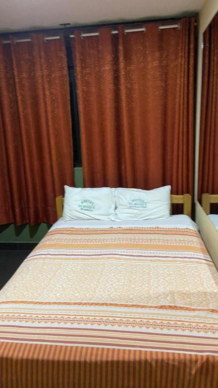 Postel nebo postele na pokoji v ubytování Hostal El Bosque
