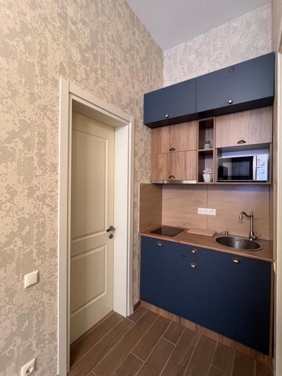 Kuchyň nebo kuchyňský kout v ubytování Albatross Luxe Hotel