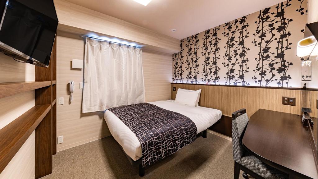 Postel nebo postele na pokoji v ubytování APA Hotel Nambaminami Daikokucho Ekimae