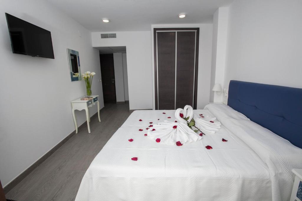 Postel nebo postele na pokoji v ubytování Hostal Boutique Bajamar
