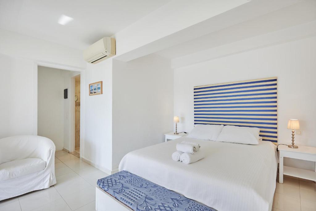 Postel nebo postele na pokoji v ubytování Gerakas Belvedere hotel