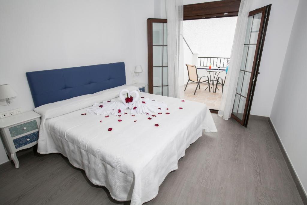 Postel nebo postele na pokoji v ubytování Hostal Boutique Bajamar