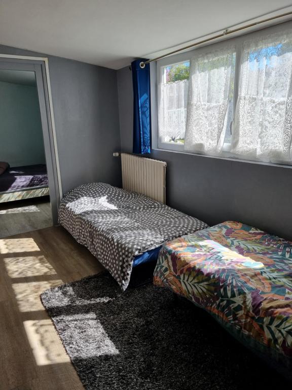 Postel nebo postele na pokoji v ubytování Logement à 100m de la mer