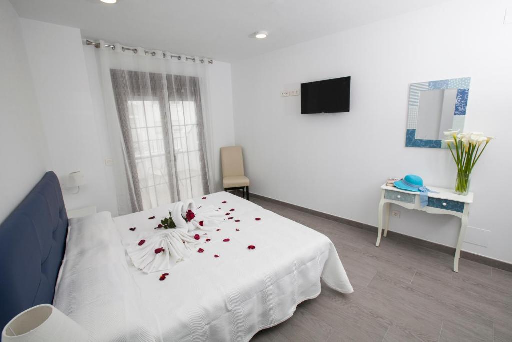 Postel nebo postele na pokoji v ubytování Hostal Boutique Bajamar