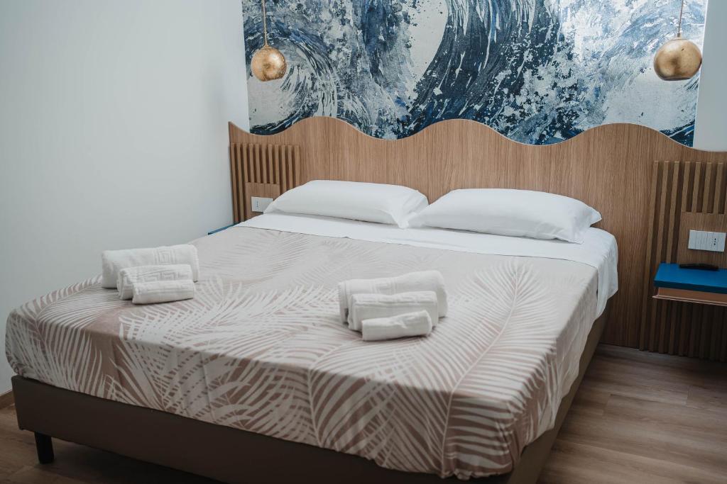Postel nebo postele na pokoji v ubytování Hotel Ficocella