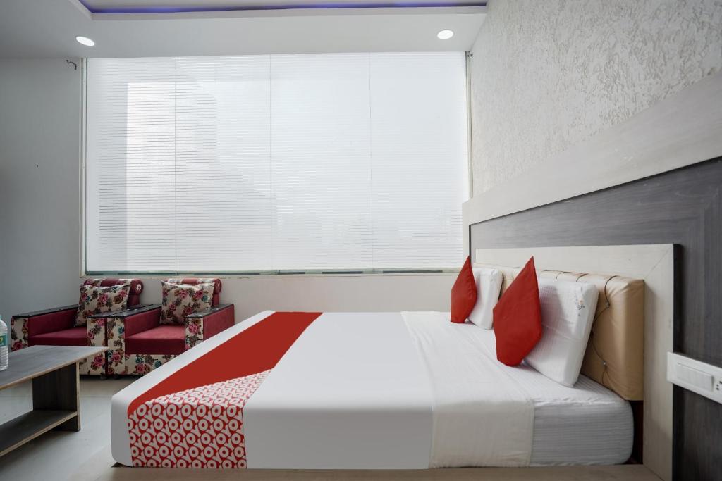 Postel nebo postele na pokoji v ubytování HOTEL O PRIME ROSE
