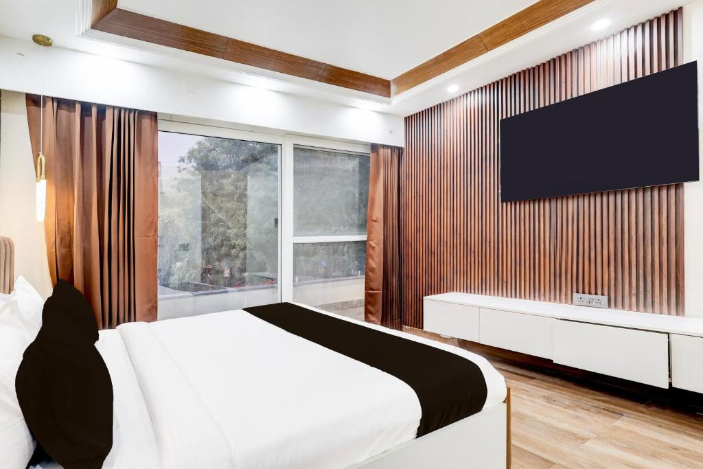 Postel nebo postele na pokoji v ubytování Super Hotel O Sector 43 Gurgaon