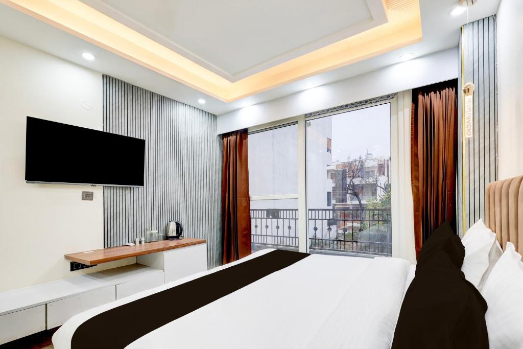 Postel nebo postele na pokoji v ubytování Super Hotel O Sector 43 Gurgaon