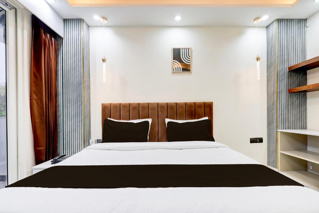 Postel nebo postele na pokoji v ubytování Super Hotel O Sector 43 Gurgaon
