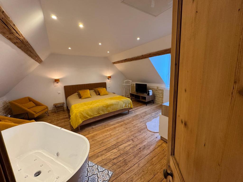 Postel nebo postele na pokoji v ubytování Gîte du Manoir de Berville