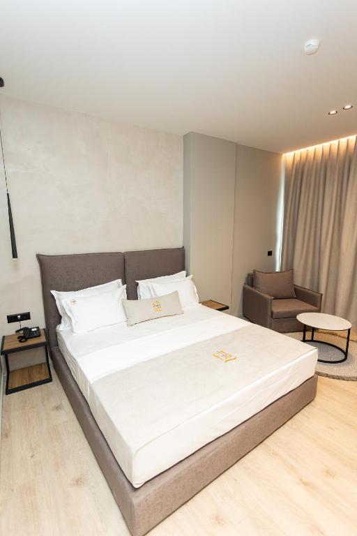 Postel nebo postele na pokoji v ubytování South Inn Hotel