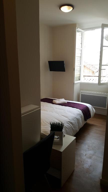 Postel nebo postele na pokoji v ubytování Hotel Belvue