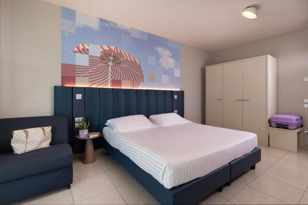 Postel nebo postele na pokoji v ubytování Mercure Hotel Rimini Artis