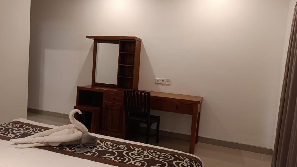 Letto o letti in una camera di Nugraha Guesthouse 1