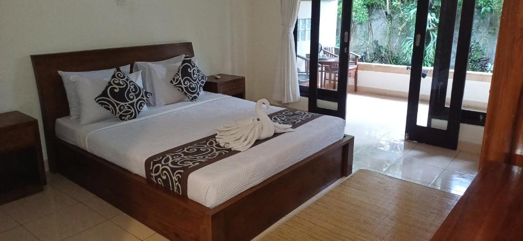 Letto o letti in una camera di Nugraha Guesthouse 1