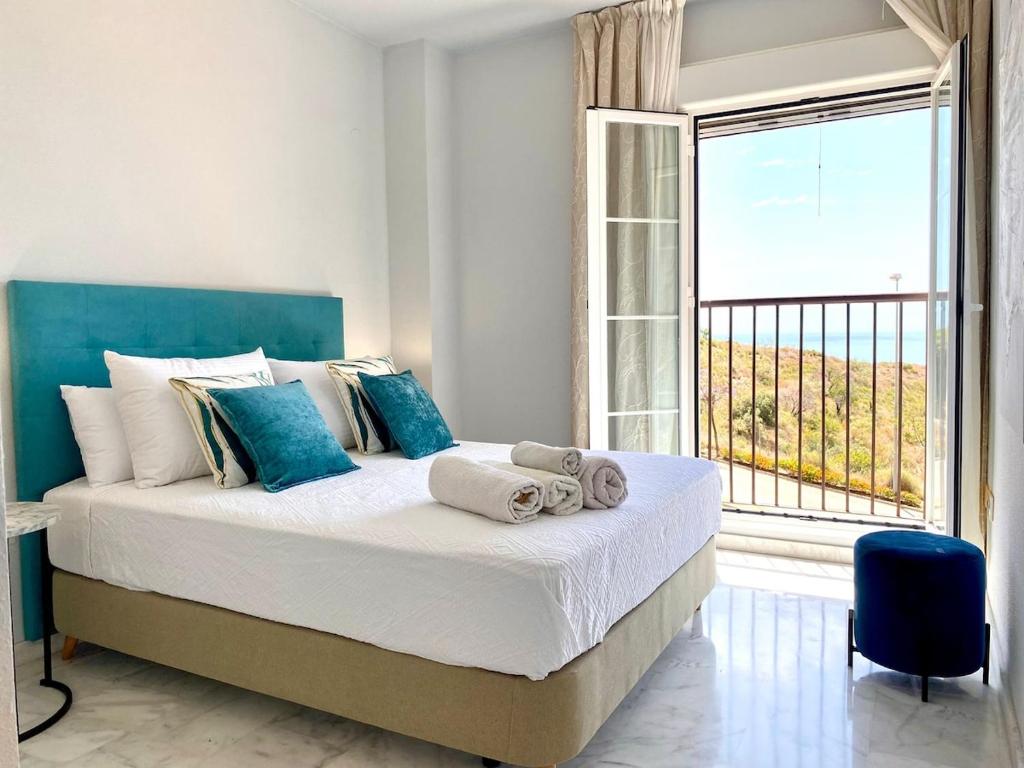 Ένα ή περισσότερα κρεβάτια σε δωμάτιο στο La Cala Sun Apartment