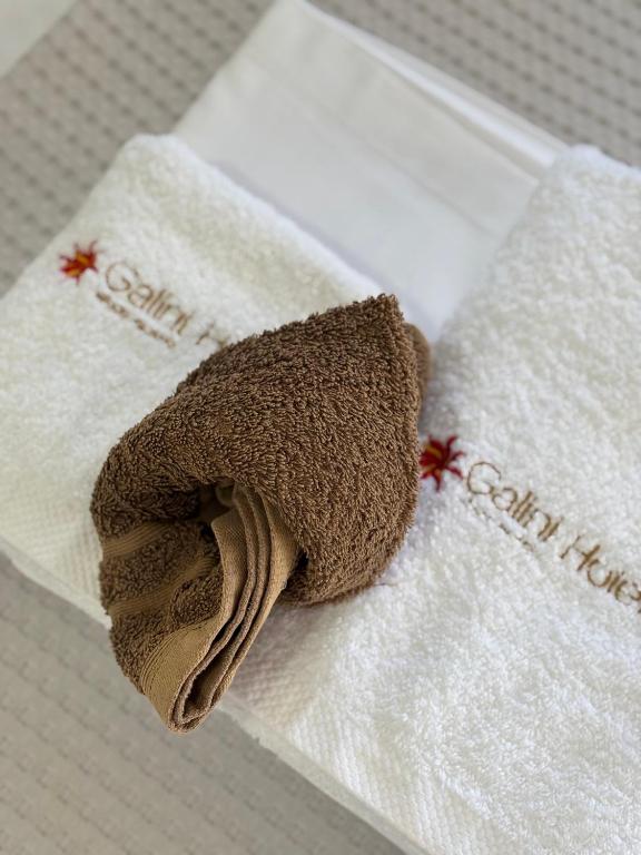 a towel sitting on top of a white napkin at Galini in Agia Irini Milos