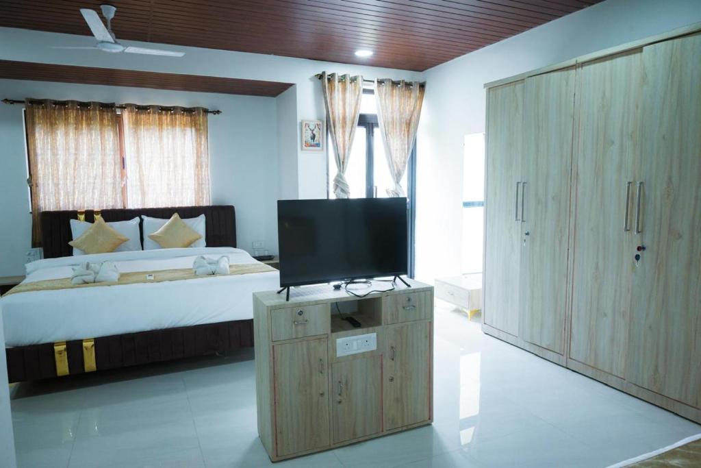 Postel nebo postele na pokoji v ubytování Goa Villagio, Candolim - A Unit of IHM