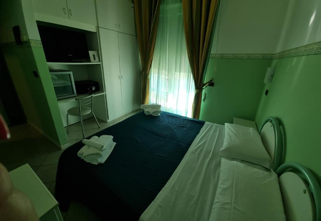 Postel nebo postele na pokoji v ubytování Hotel K2 Cervia 3 stelle sup