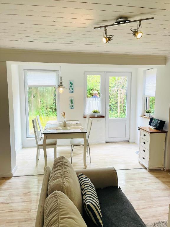 a living room with a couch and a table at Holiday Rügen Putbus in Putbus