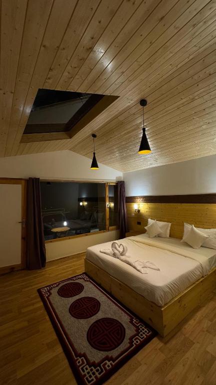 Postel nebo postele na pokoji v ubytování De Reeva Resort Pangong