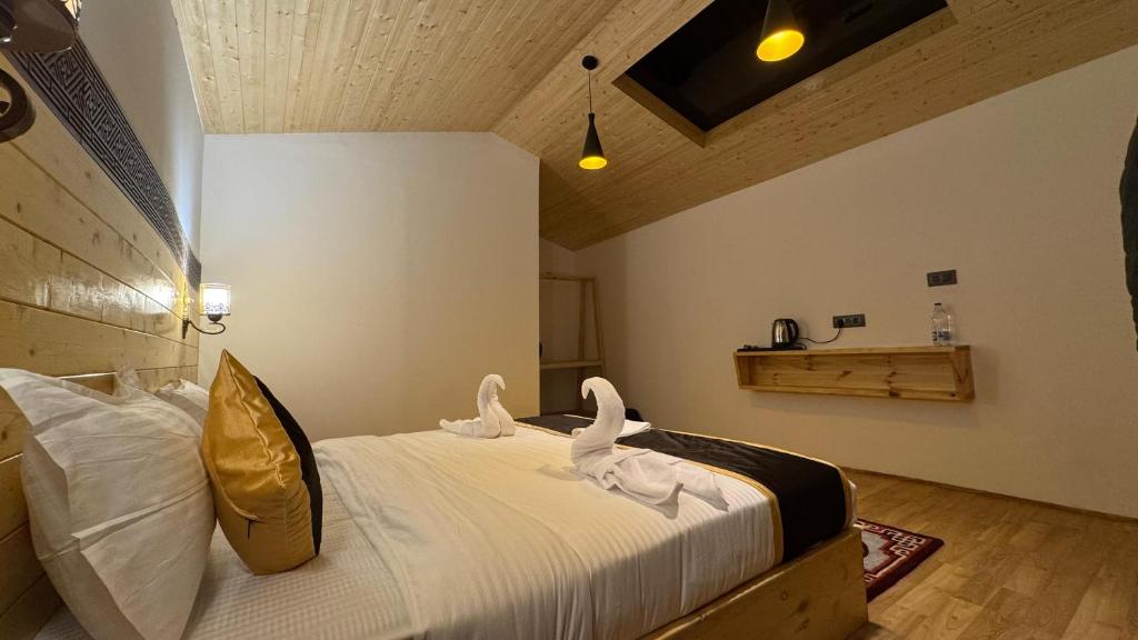 Postel nebo postele na pokoji v ubytování De Reeva Resort Pangong