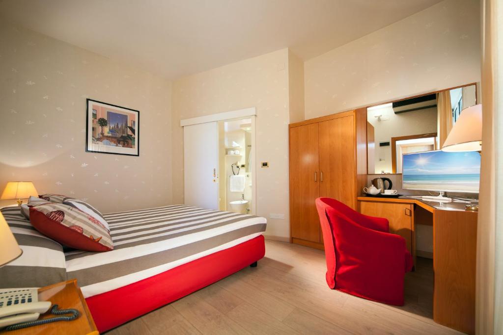Postel nebo postele na pokoji v ubytování Hotel Kursaal